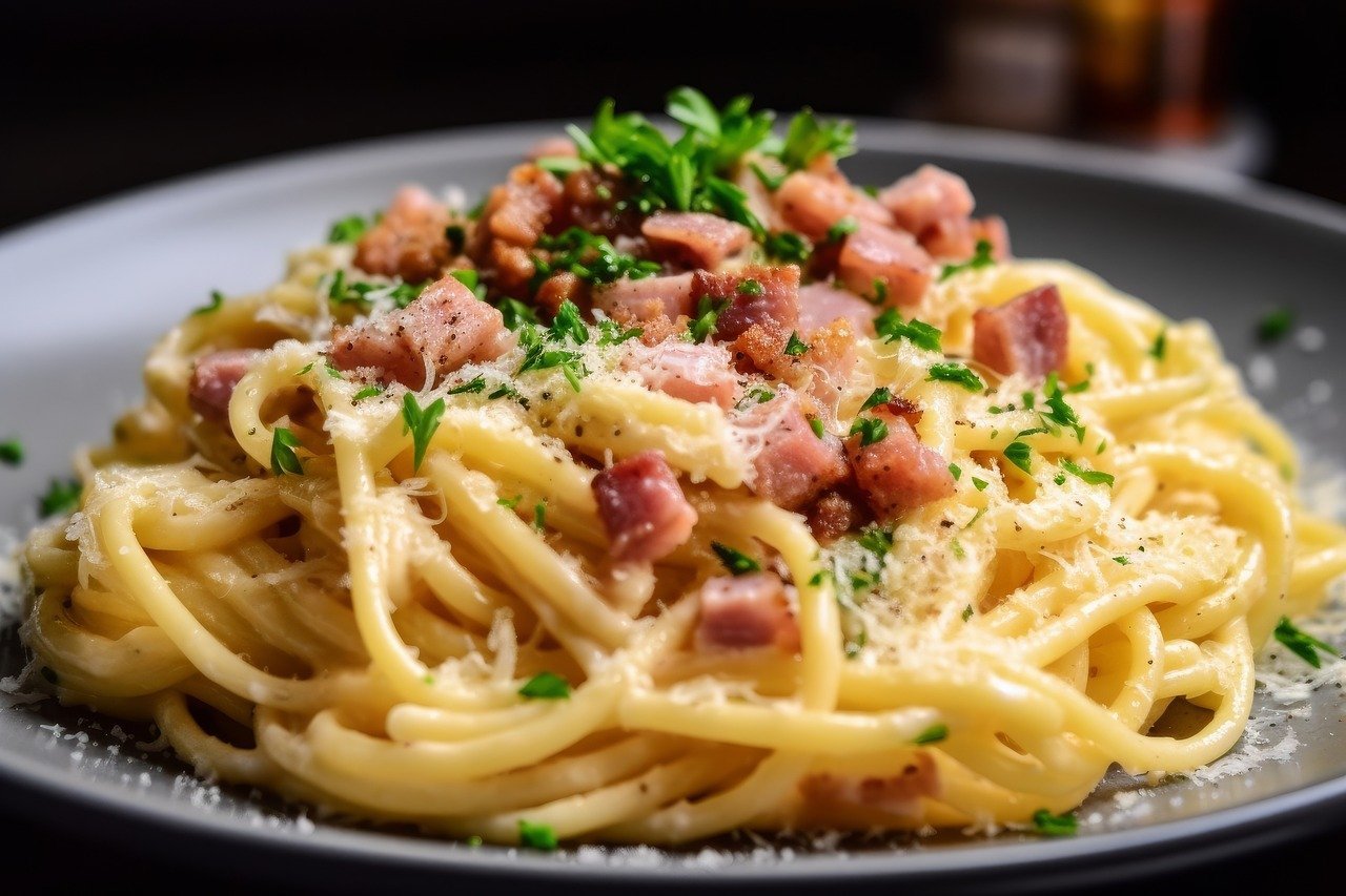 Plate of spaghetti with bacon and herbs for carbonara